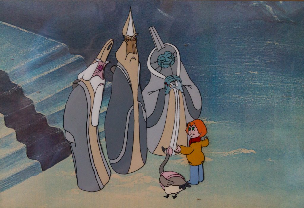 A cel showing the three aliens descending the staircase, greeting Peter and Lucy.