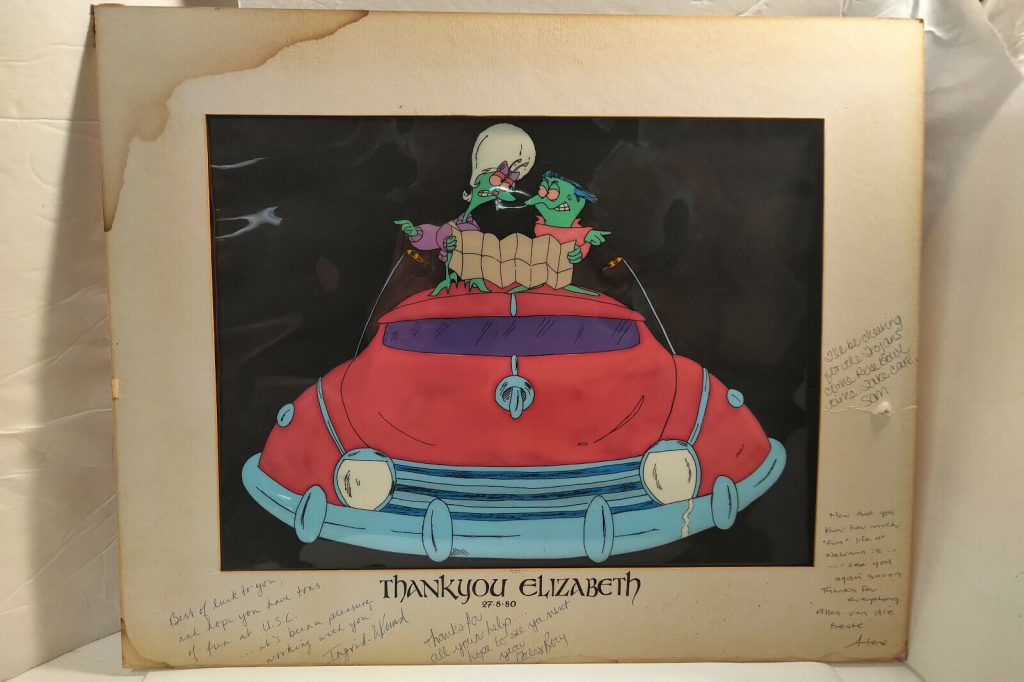 A framed cel from 'Take Me Up To The Ballgame', with best wishes messages on the matte surrounding the cel.